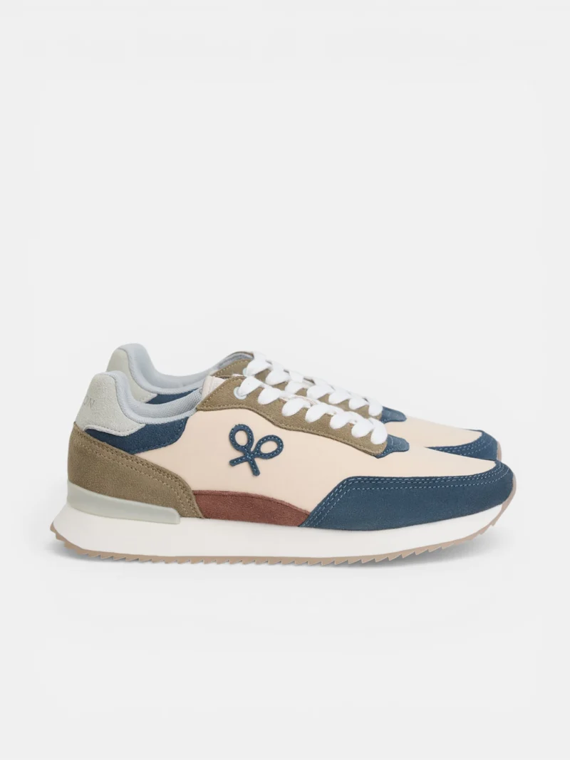 Zapatilla running raqueta beige