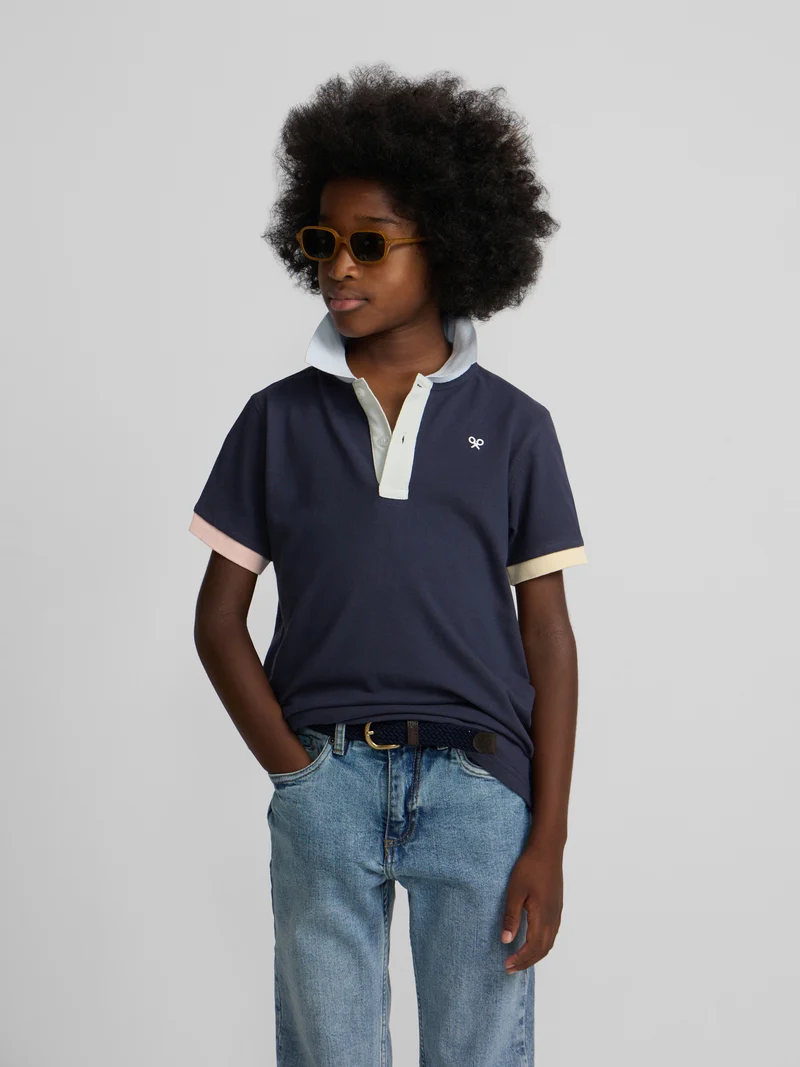 Polo kids ribete multicolor azul marino